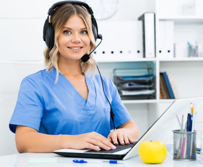Attentive specialist of medical call center in headphones in office. High quality photo